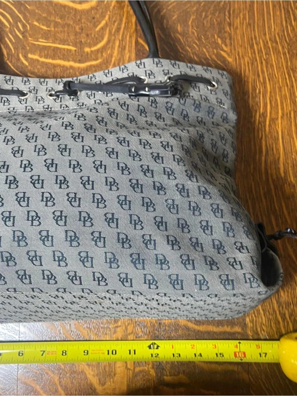 Dooney & Bourke Vintage Gray Canvas Monogram Tote with Black Trim and Tassel.